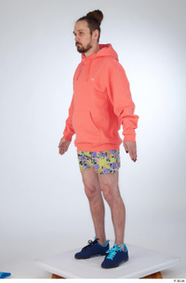 Nigel a-pose blue sneakers dressed floral printed shorts salmon hoodie…